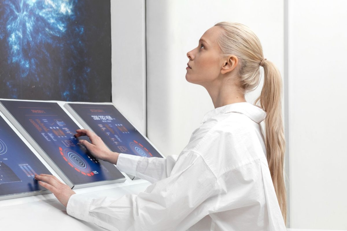 image | Digilite | Web Design Company in Glendale CA Healthcare professional analyzing medical data on a high-tech digital dashboard.